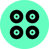 A green circle with four black circles on it.